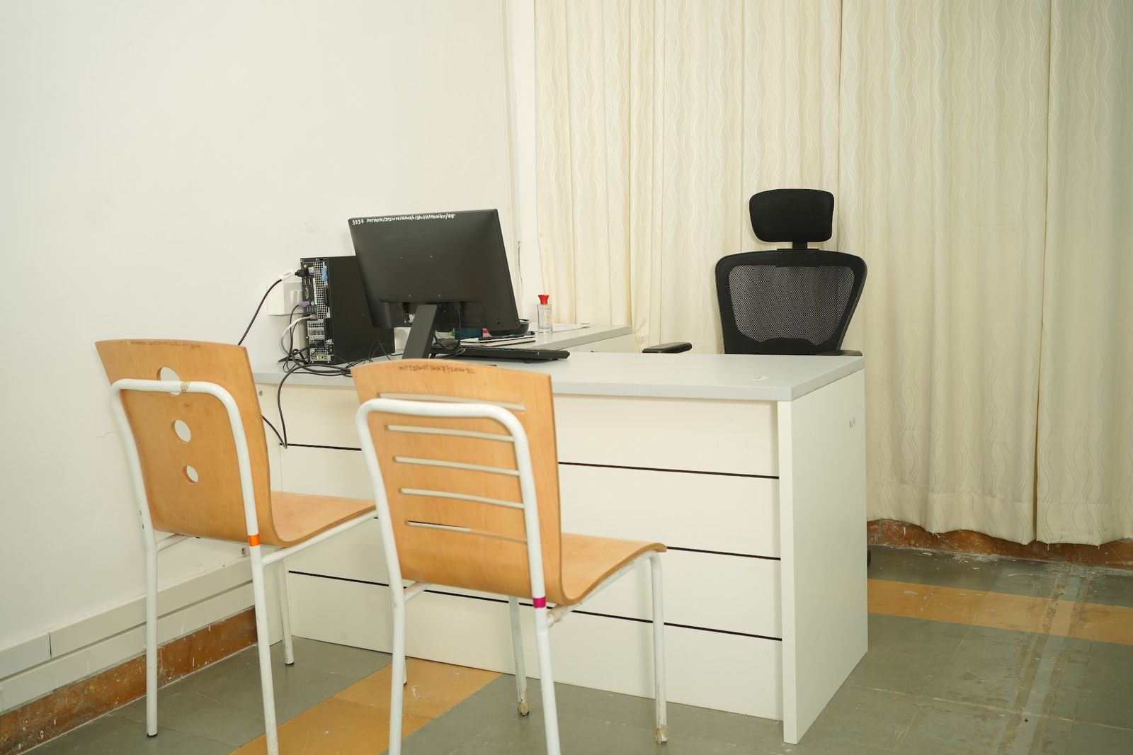 Faculty desk with storage drawers in a computer lab