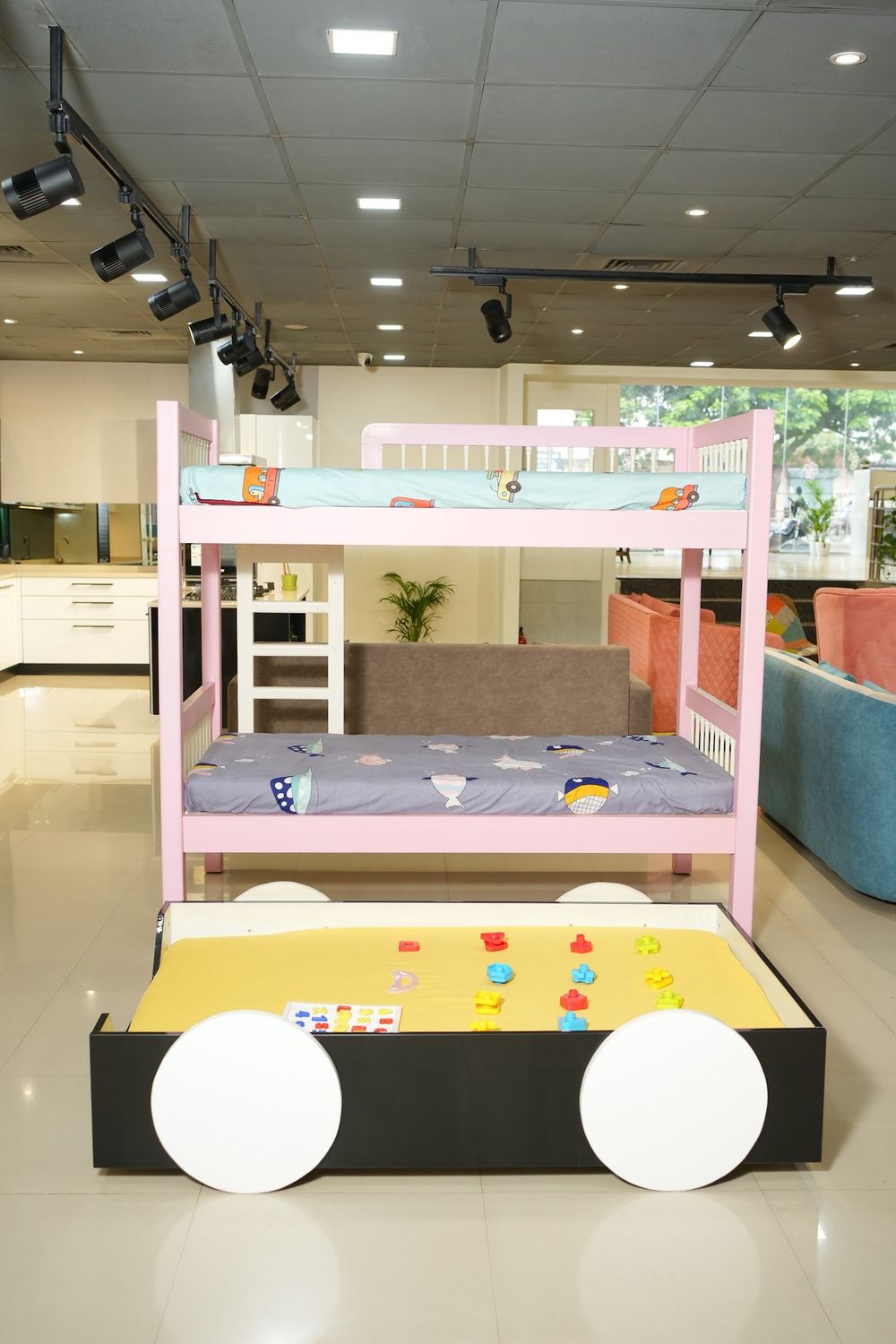 Pink bunk bed with a play bed below in the AS9 showroom