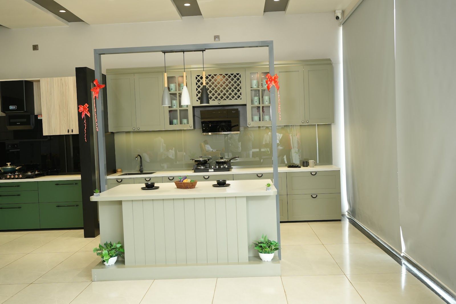 Sage green shaker-style kitchen on display in the AS9 showroom