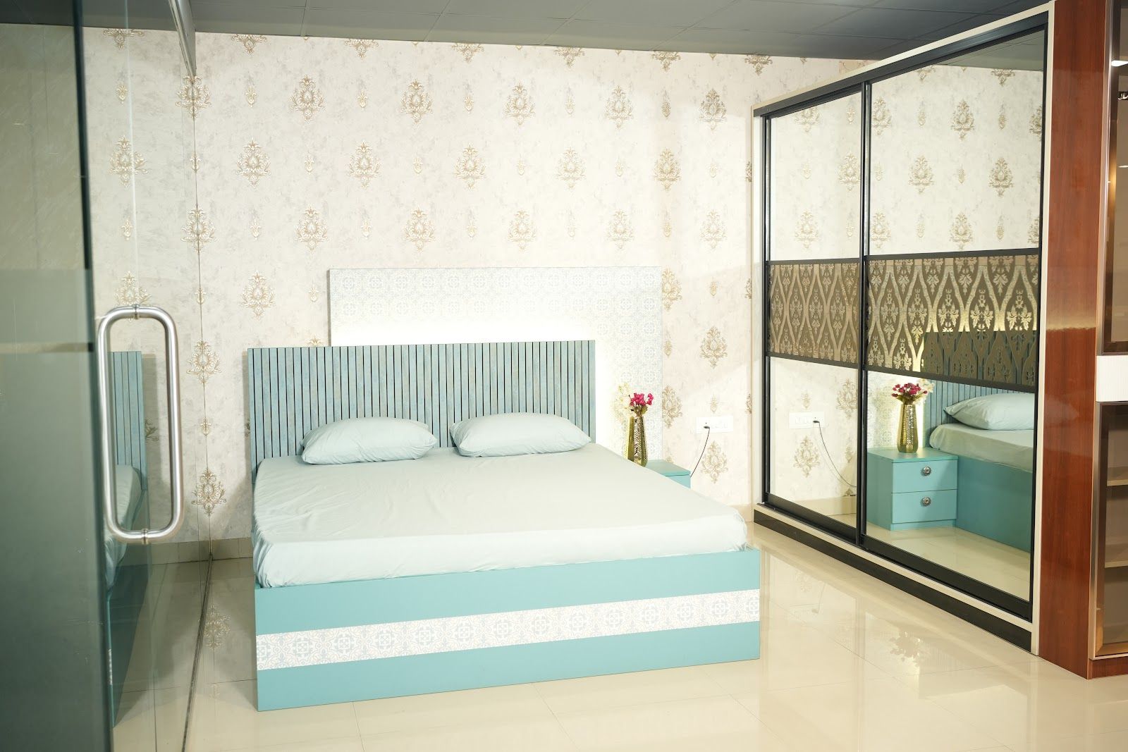 Upholstered bed with a wallpaper headboard wall in the AS9 showroom