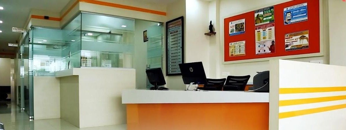 Bank branch interior with counters and glass cabins by AS9 Interiors